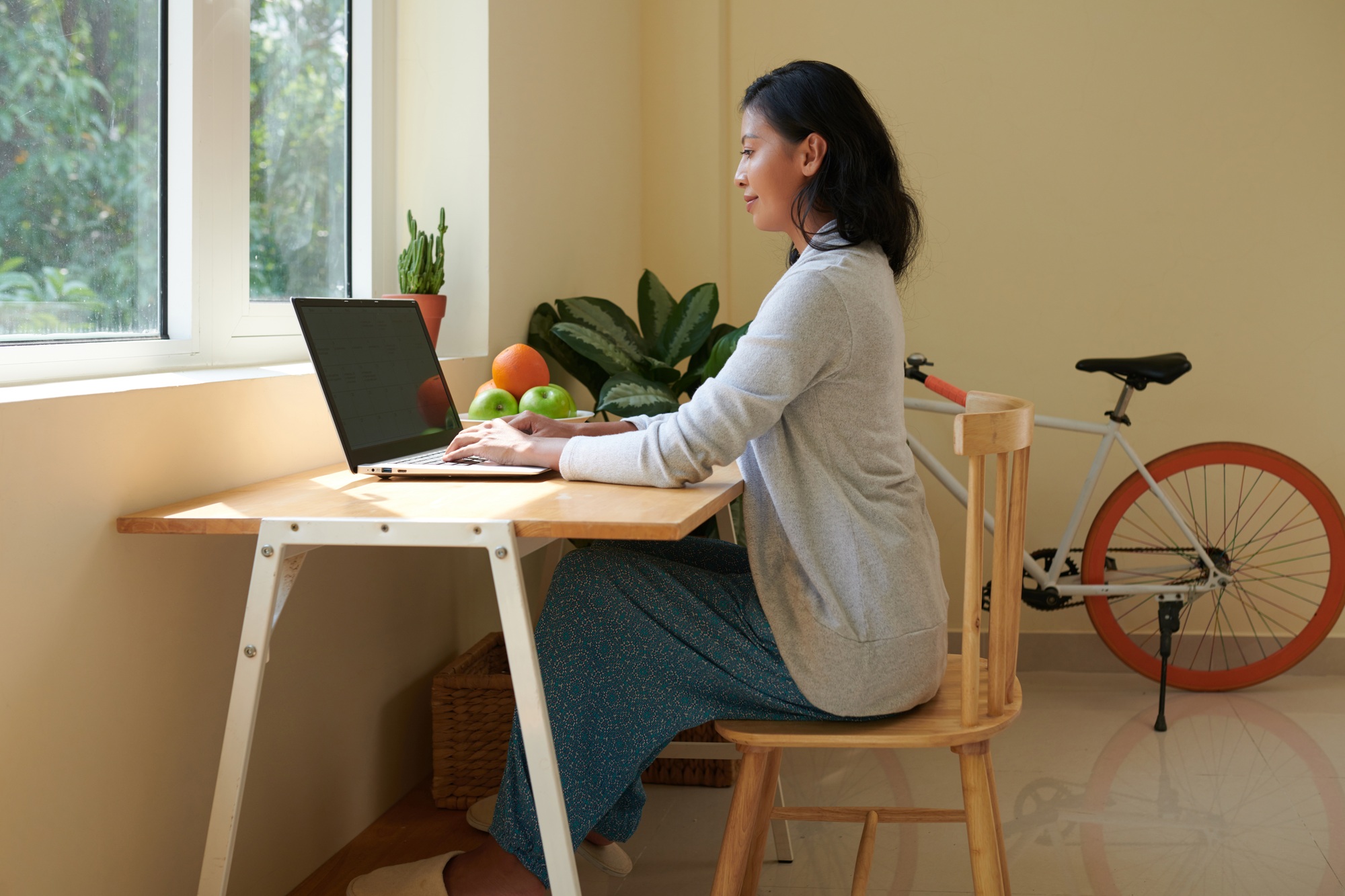 Woman with Good Posture Working on Laptop